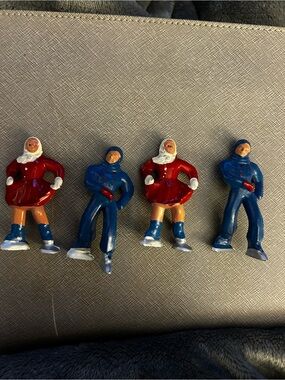 These are vintage 1930s-1950s cast lead ice skater figurines
